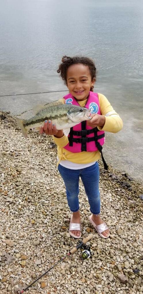 little girl fishing holding small mouth bass table rock lake fishing