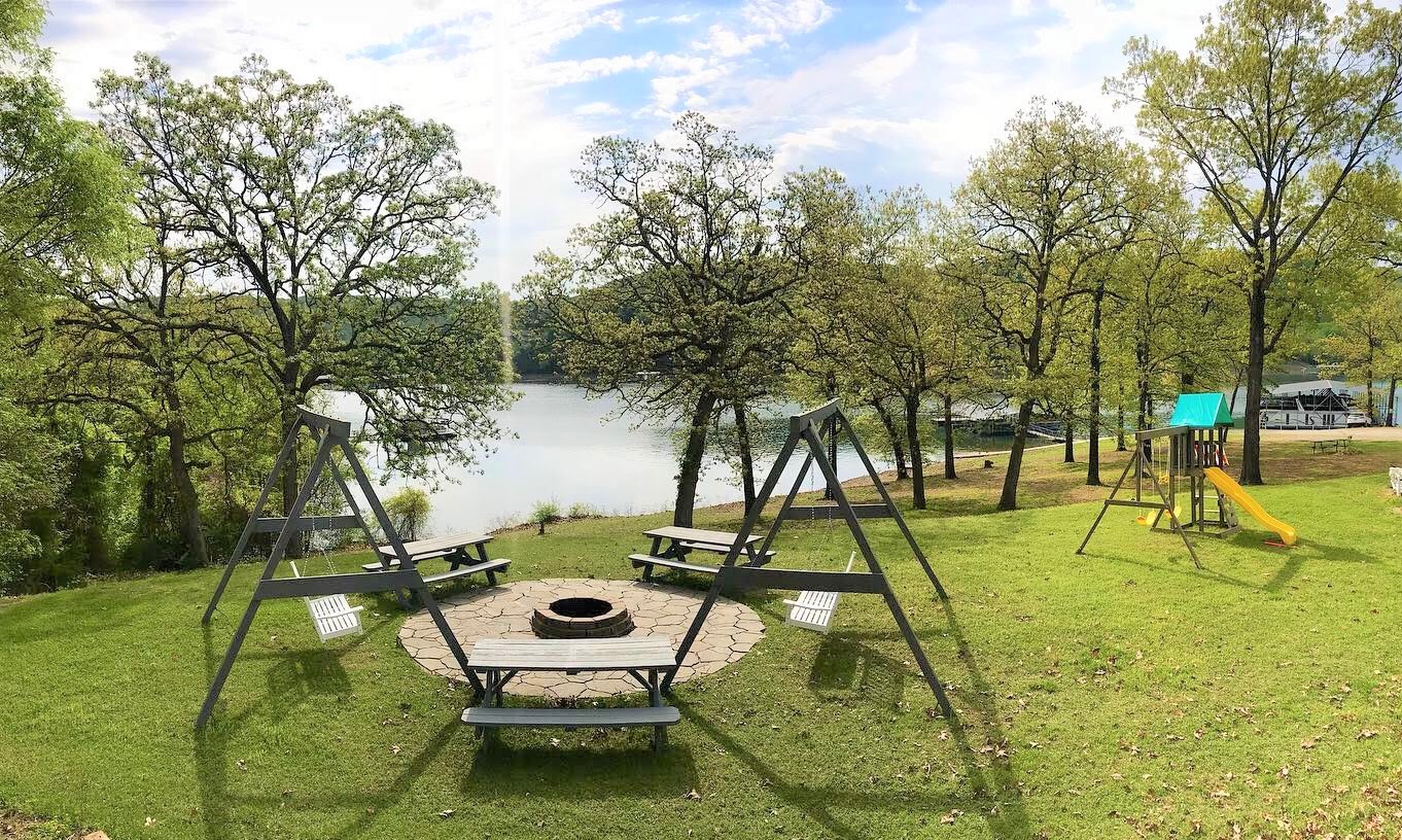 Swings and tables at the fire-pit.