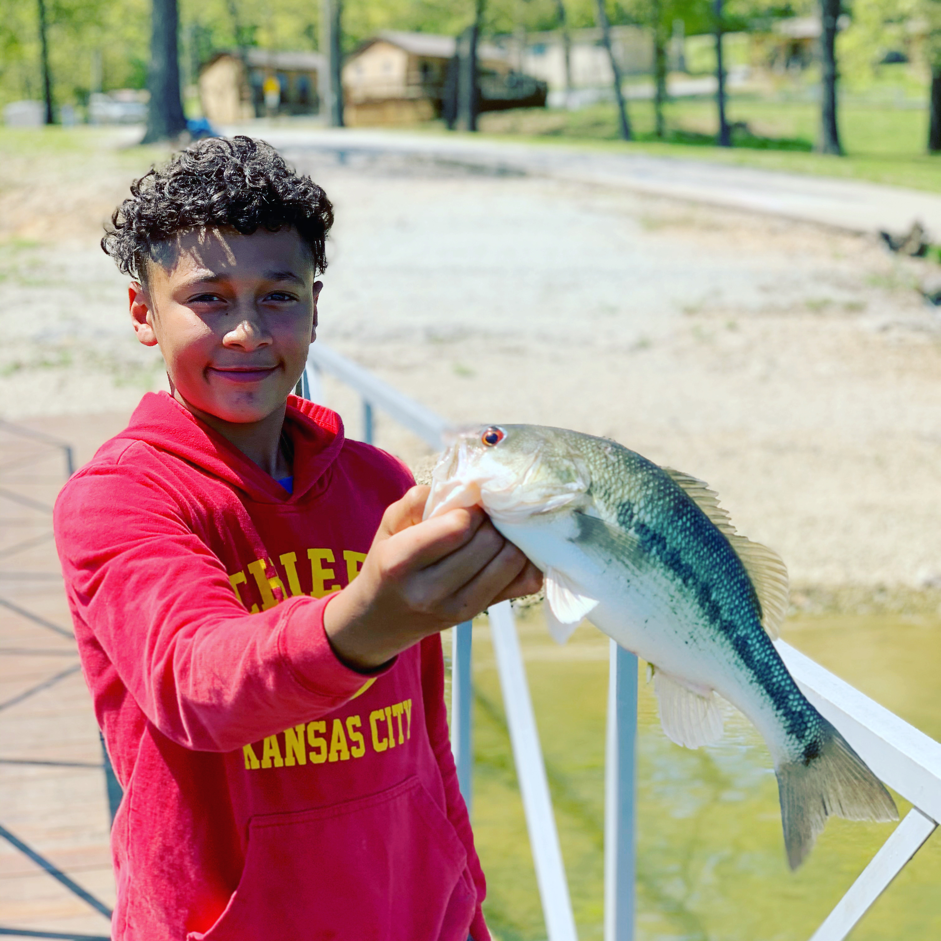boy holding gooley eye table rock lake fishing