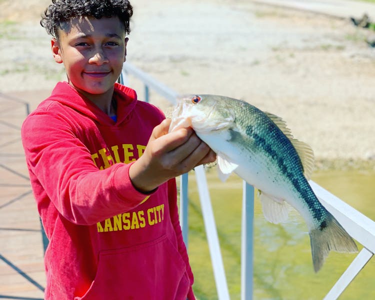 boy holding gooley eye table rock lake fishing
