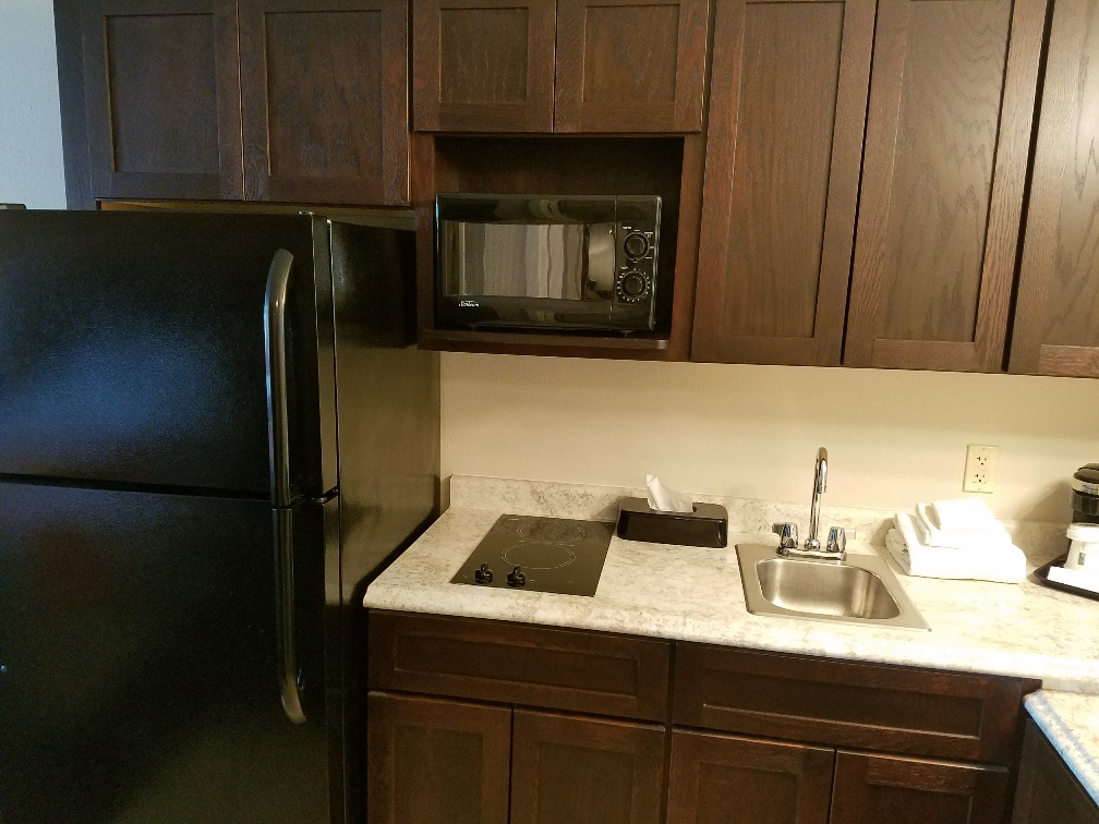 54 Extended Stay Suites with fridge & ice maker, two burner stove top, and microwave.
