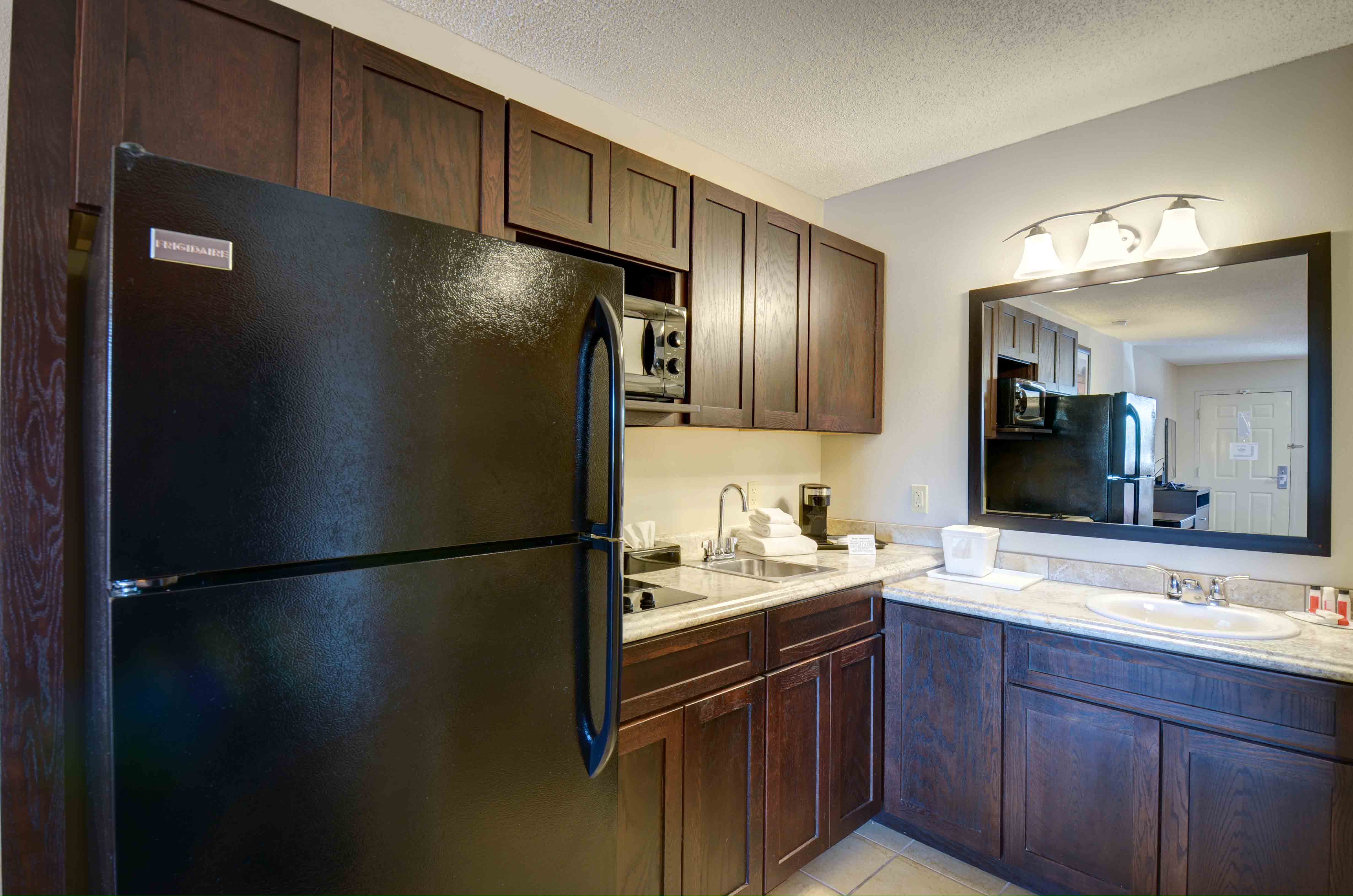 54 Extended Stay Suites with full size fridge with icemaker, two burner stove top, and microwave