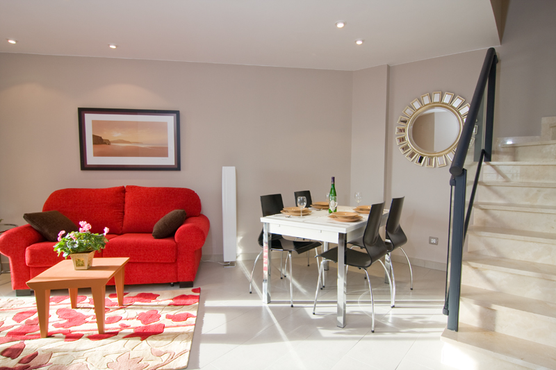 boulevard apartamentos by mimar living and dining room