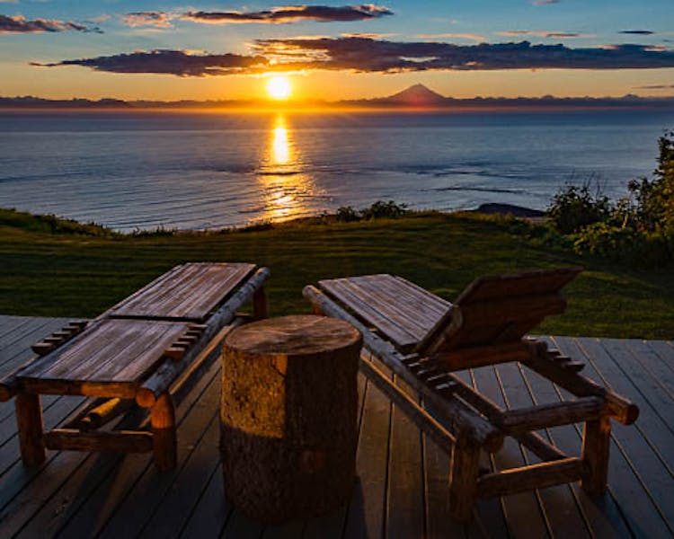 Sunset view of Mt Redoubt from the deck of one of he guest cabins