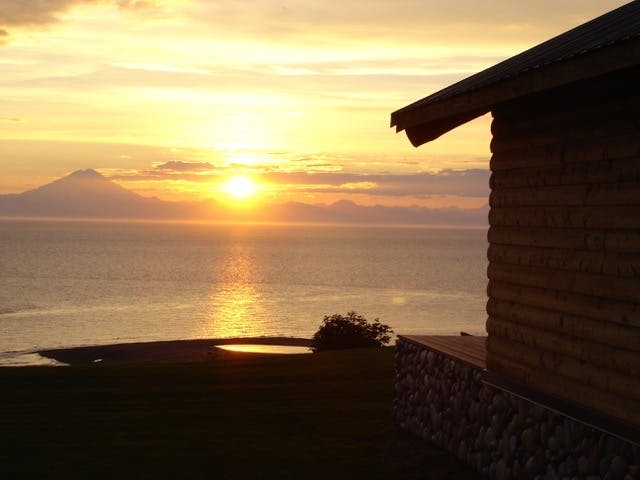 Sunset view with outline of one of the guest cabins