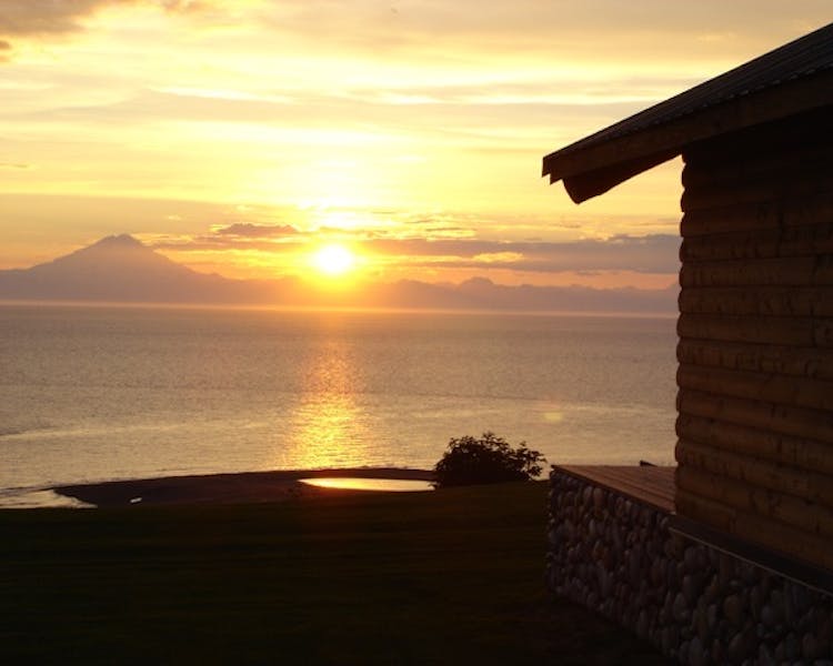 Sunset view with outline of one of the guest cabins