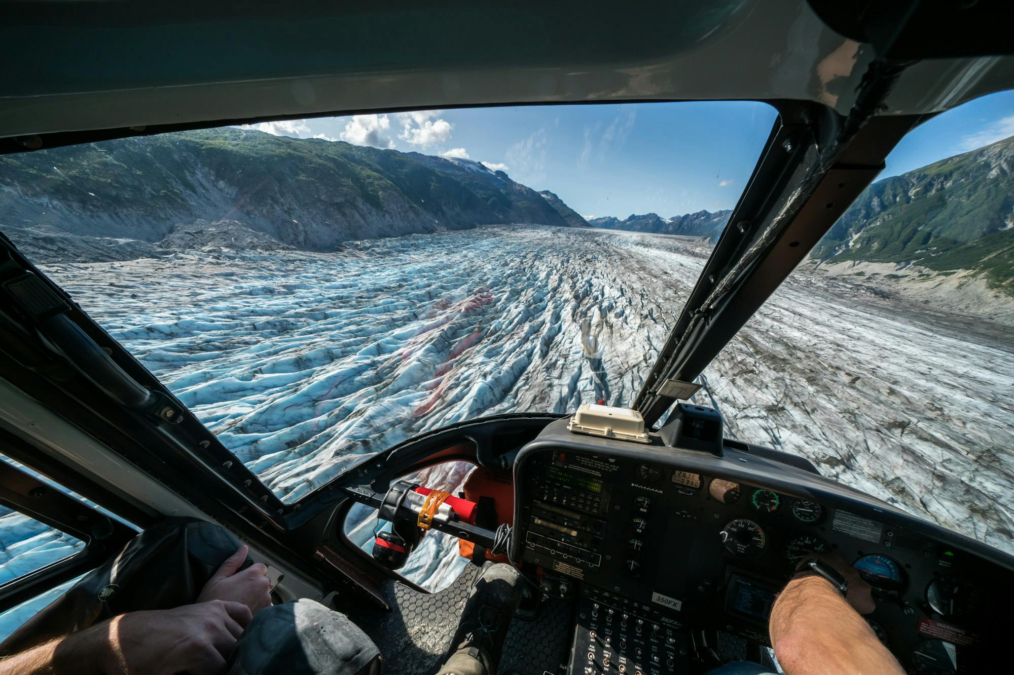 Flying over a glacier field by helicopter