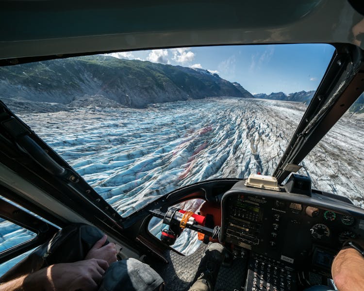Flying over a glacier field by helicopter