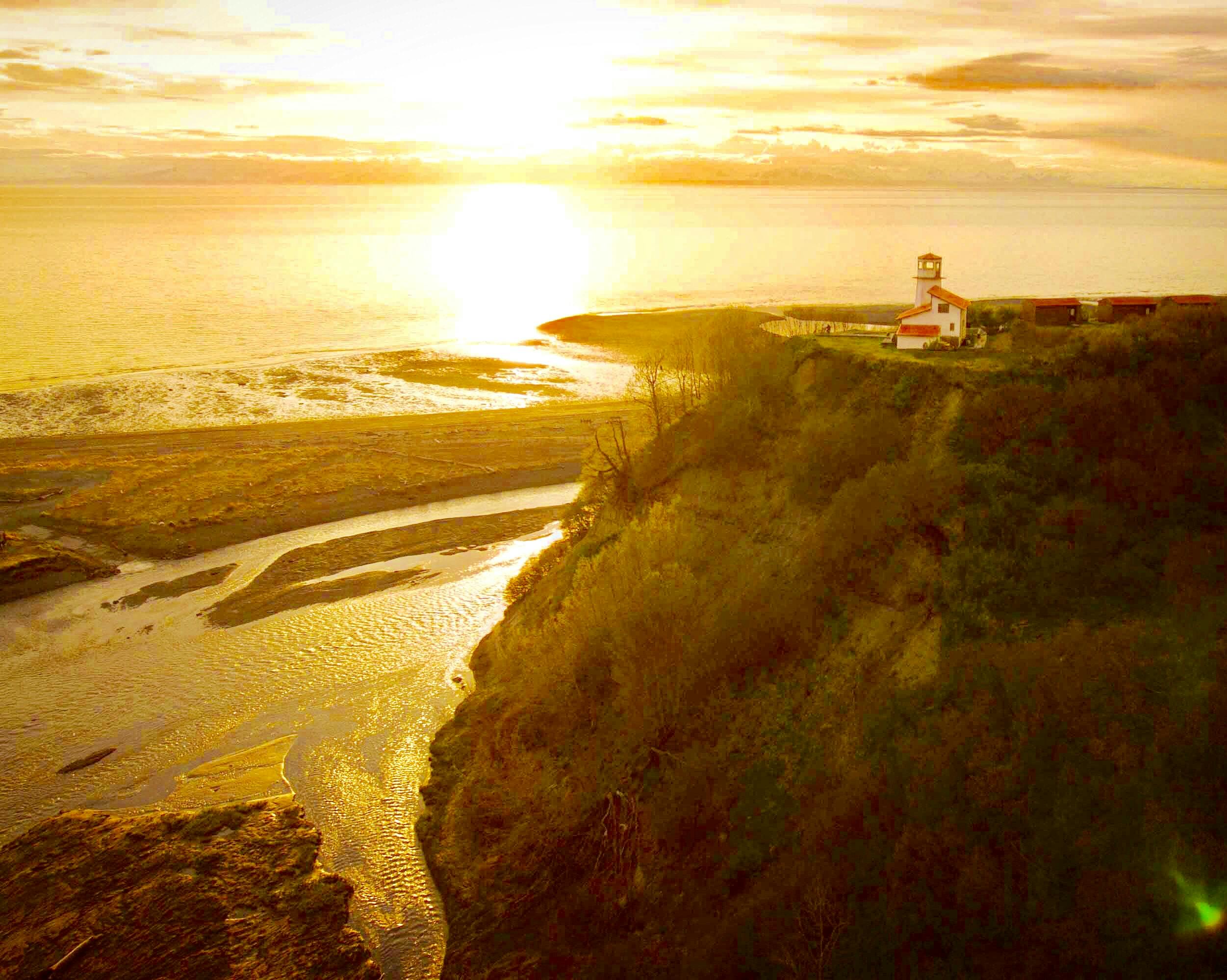 The lighthouse, perched on th bluff overlooking the mouth of Deep Creek and the shores of Cook Inlet