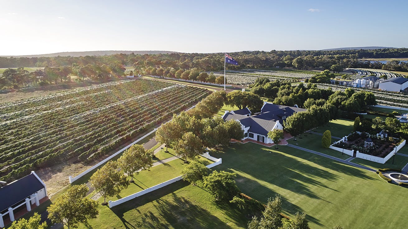 Voyager Estate drone photo, featuring their main building, gardens and vineyard