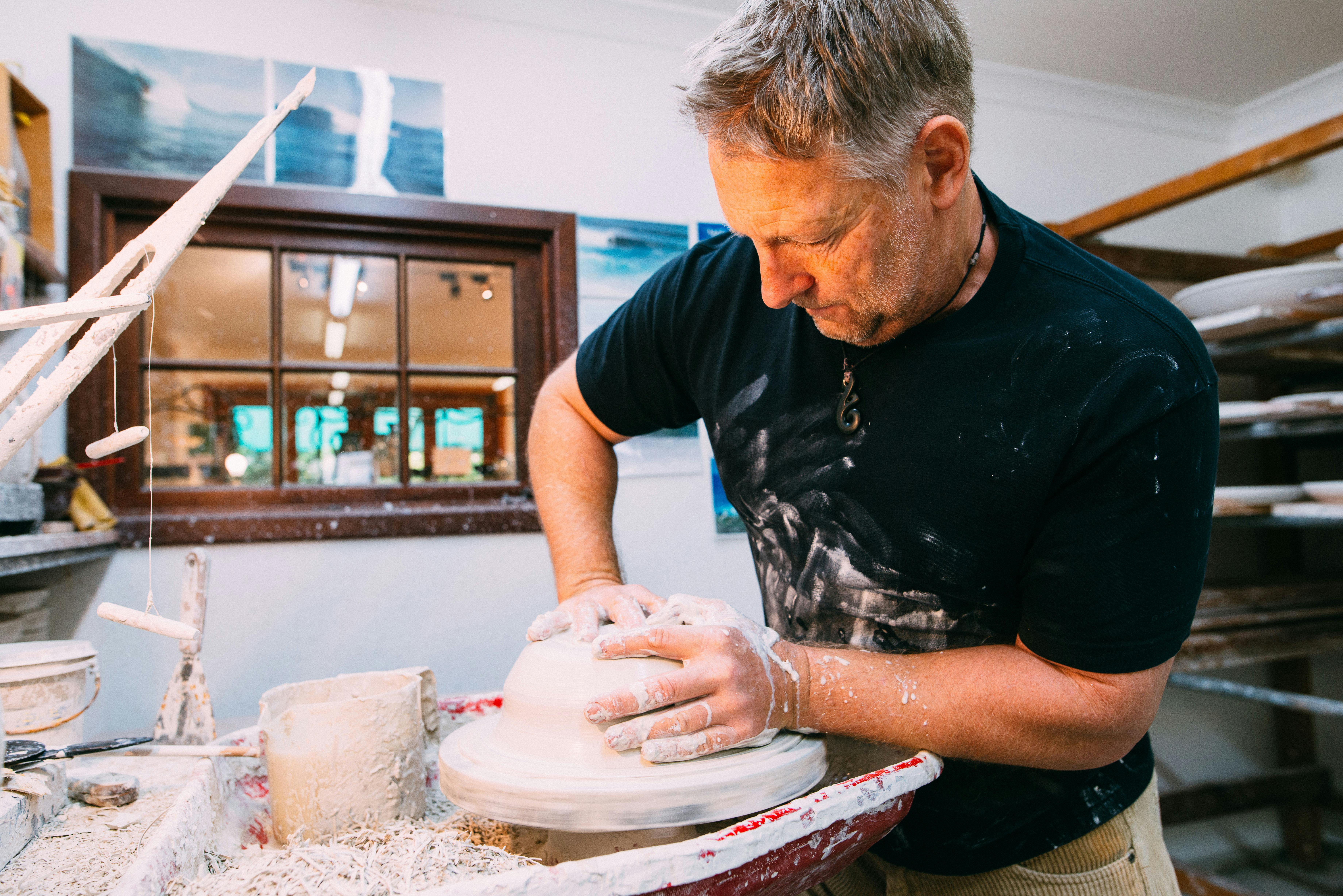 Ian Benniston making pottery