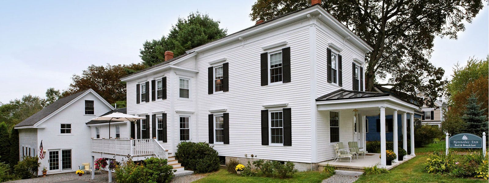 Exterior photo of the Kennebec Inn -- a white Italianate with black shutters.