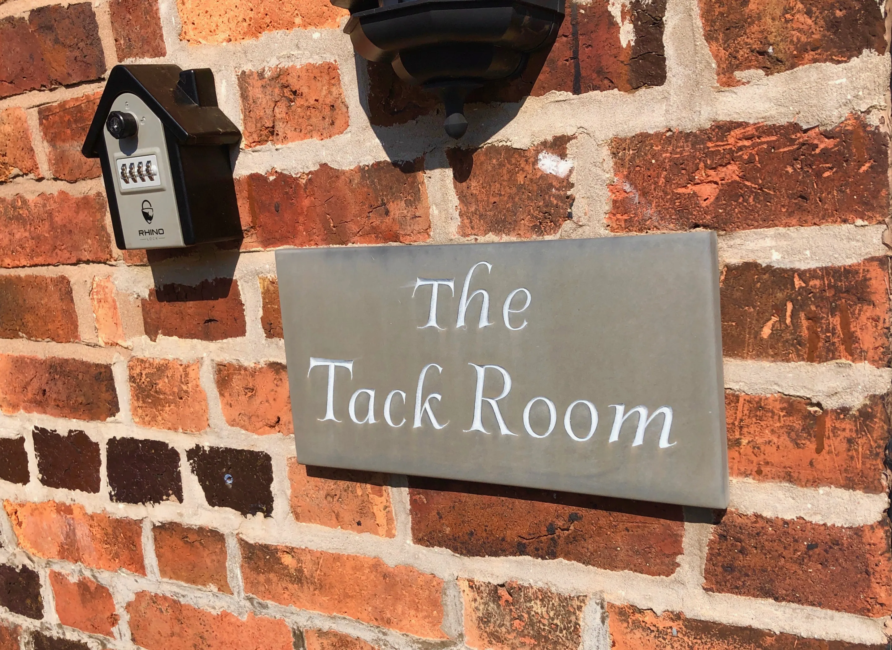 The Tack Room Entrance sign