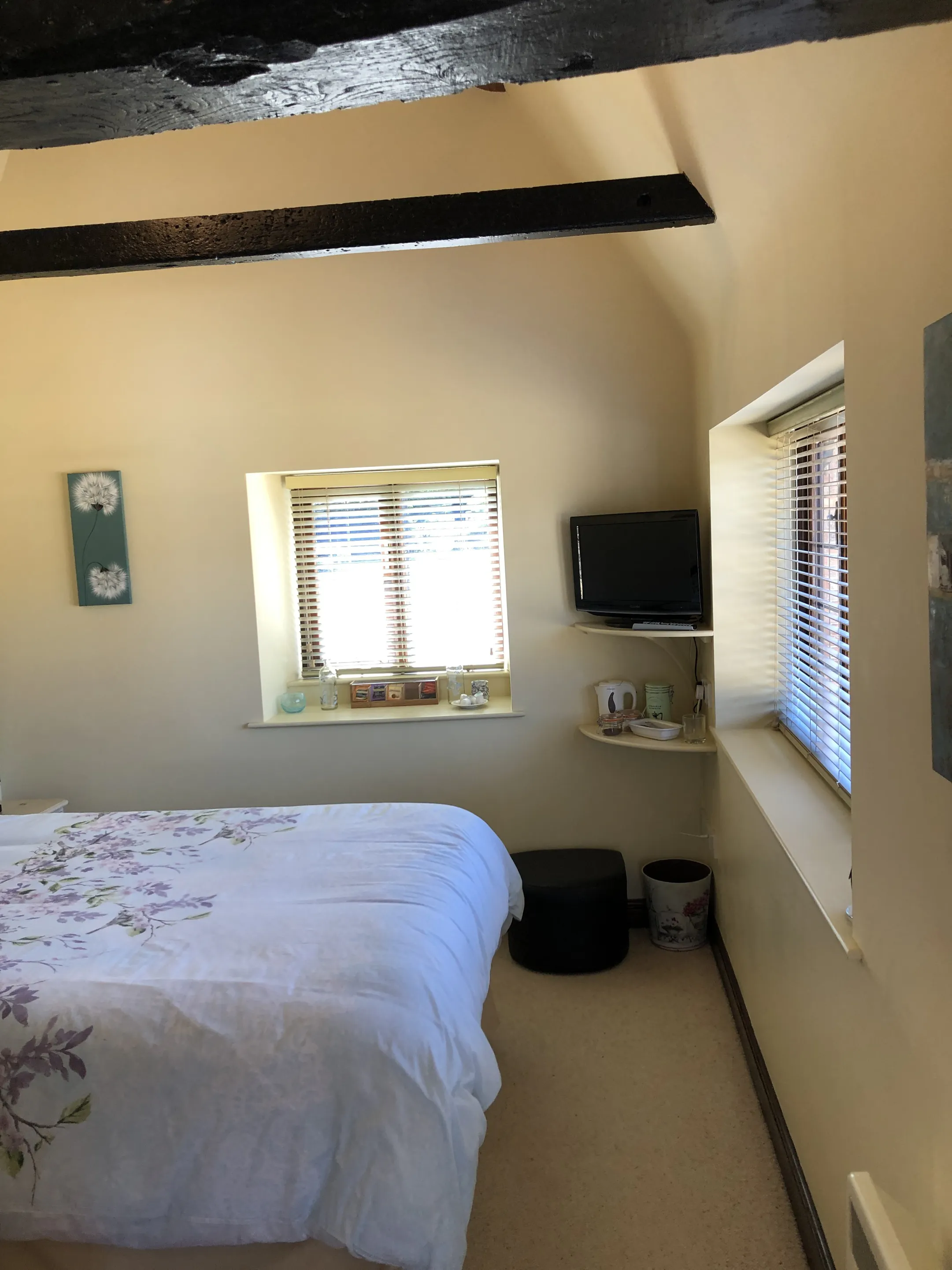 Double bedroom with exposed wooden beams