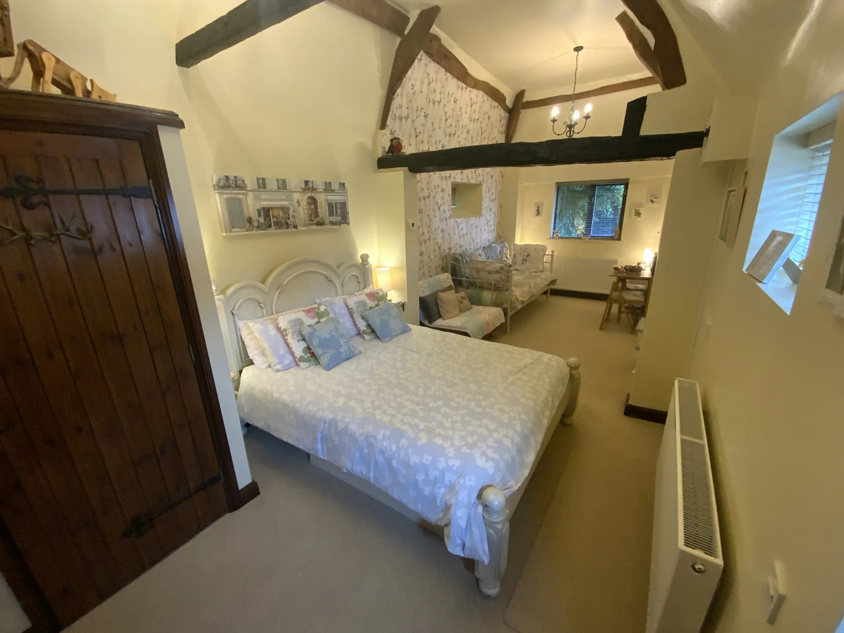 The Smith Family Bedroom with Kingsized bed and exposed beams