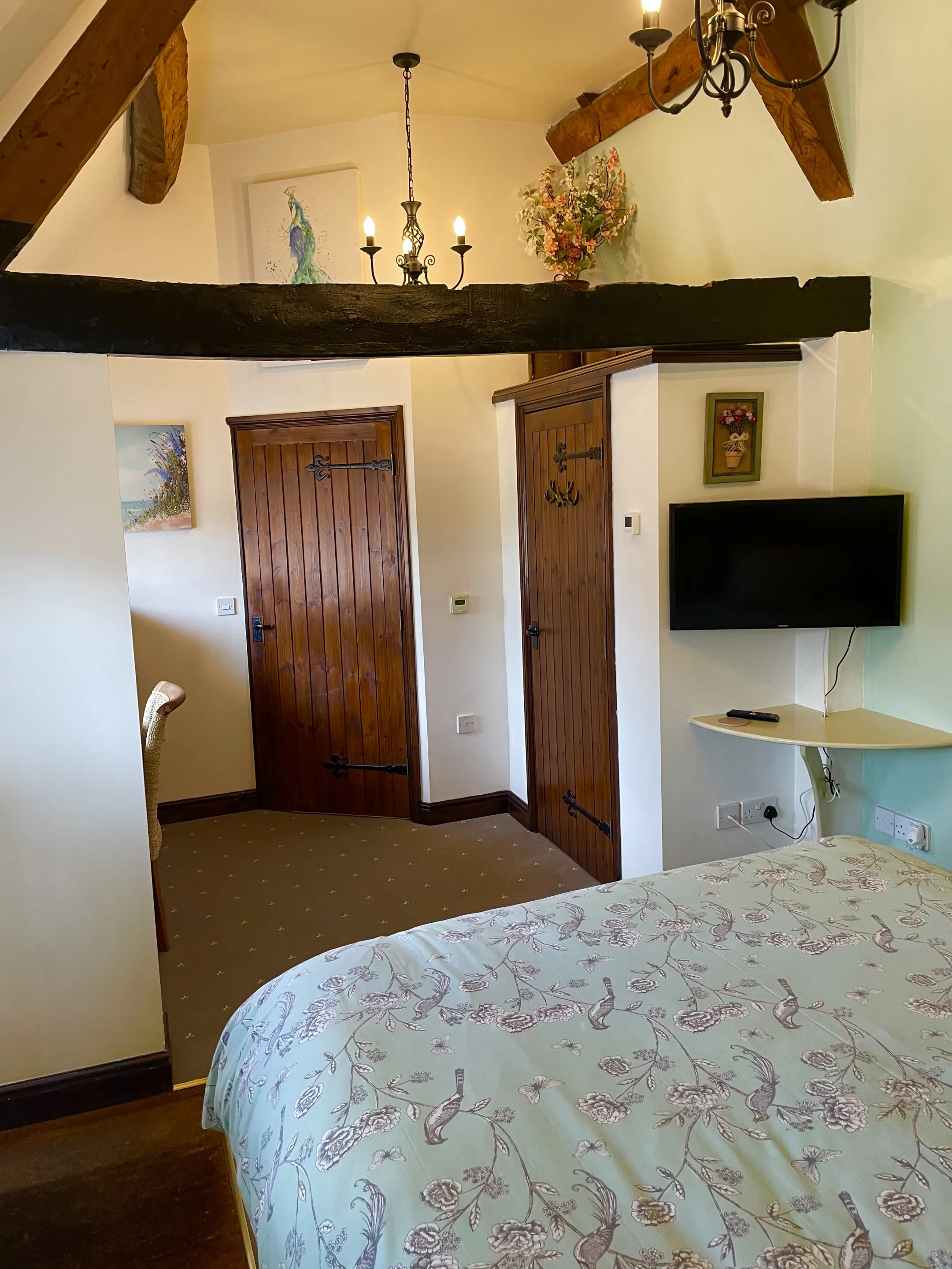 The Saddlery Kingsize bedroom with warm lighting and country decor