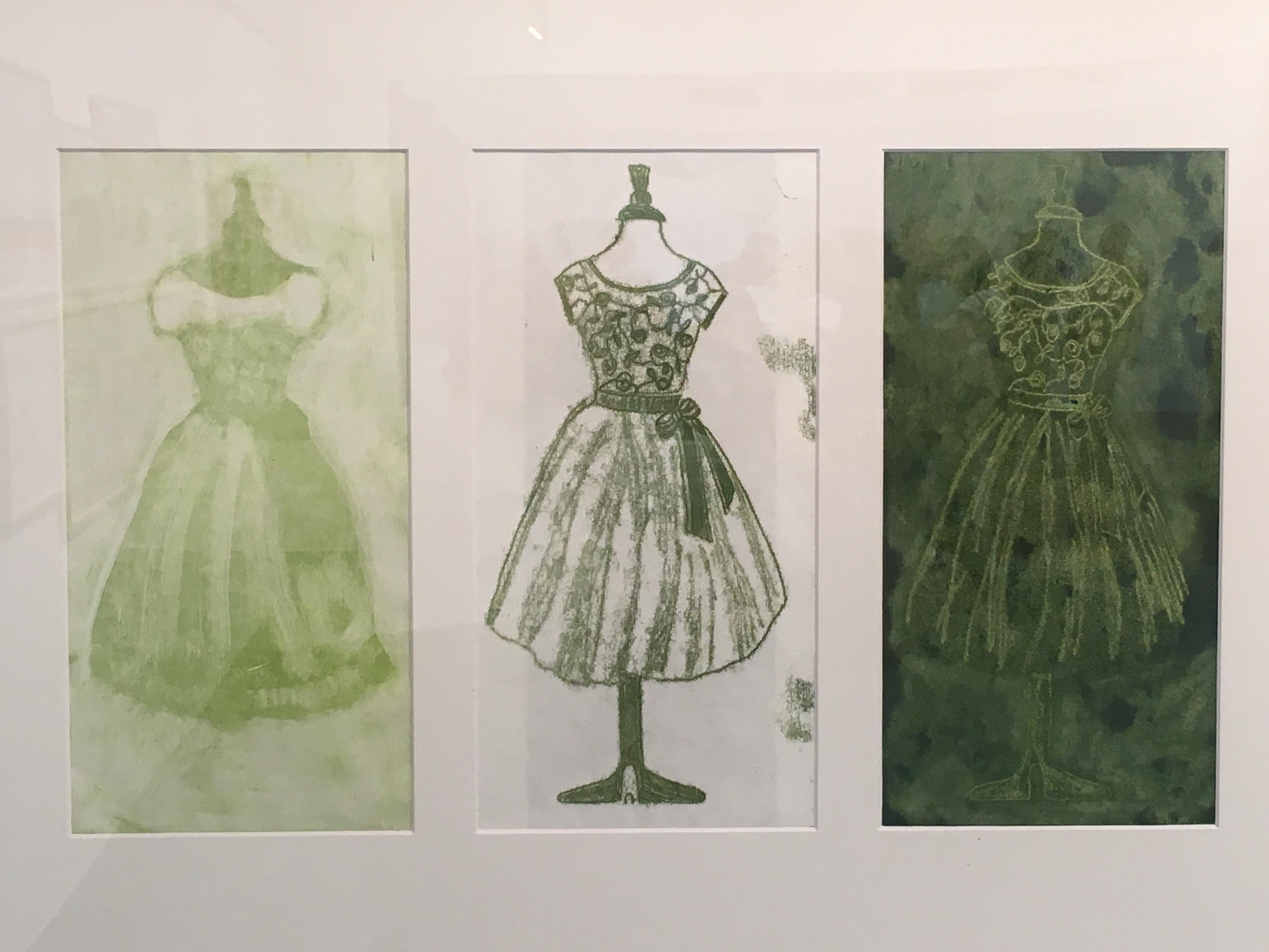 Three prints of a dress on a stand, printed in green inks.