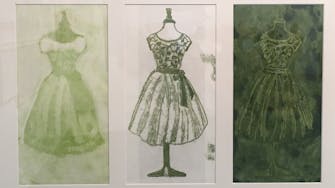 Three prints of a dress on a stand, printed in green inks.