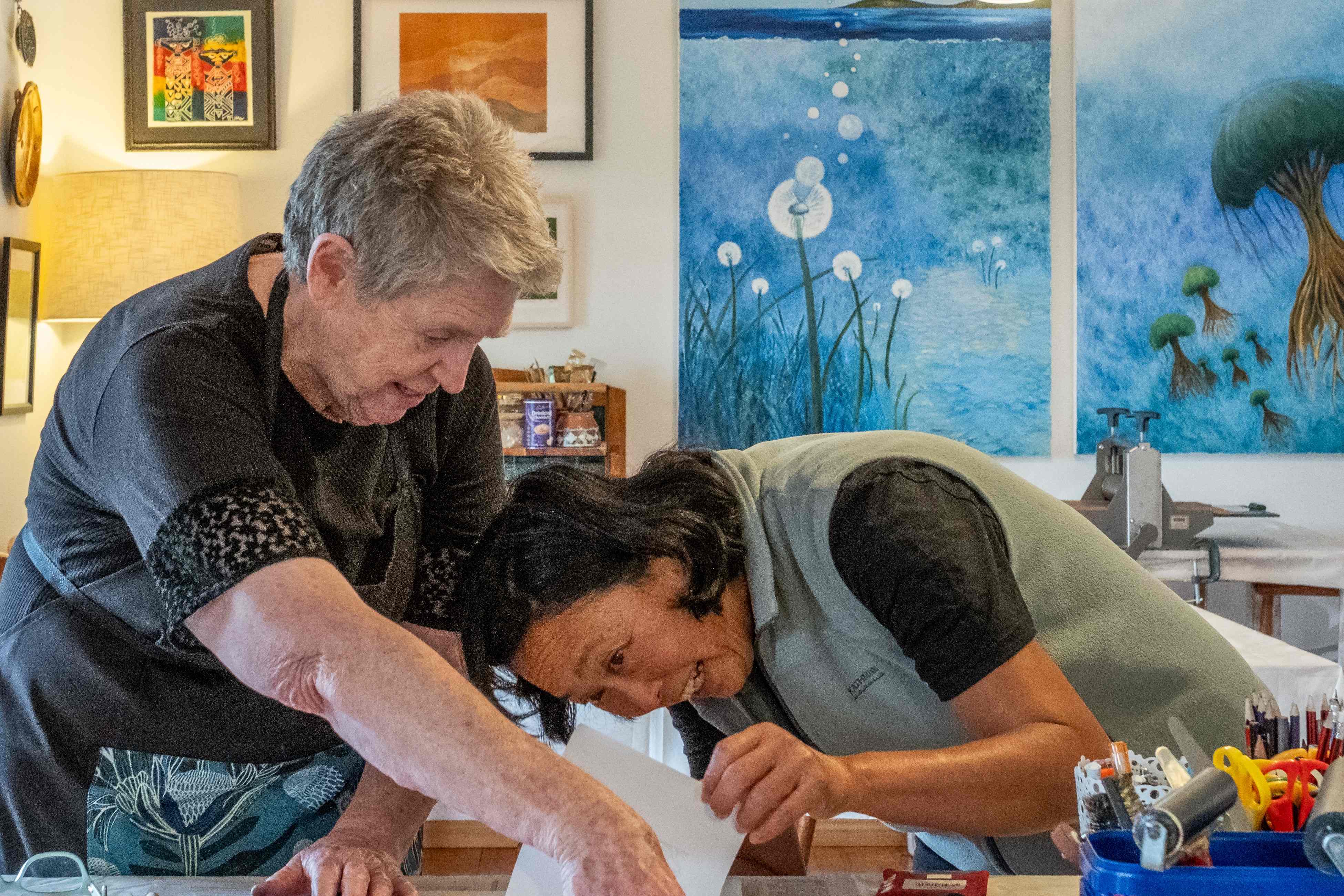 Two people engaged in contact printing. Image credit: Puddlehub 2024