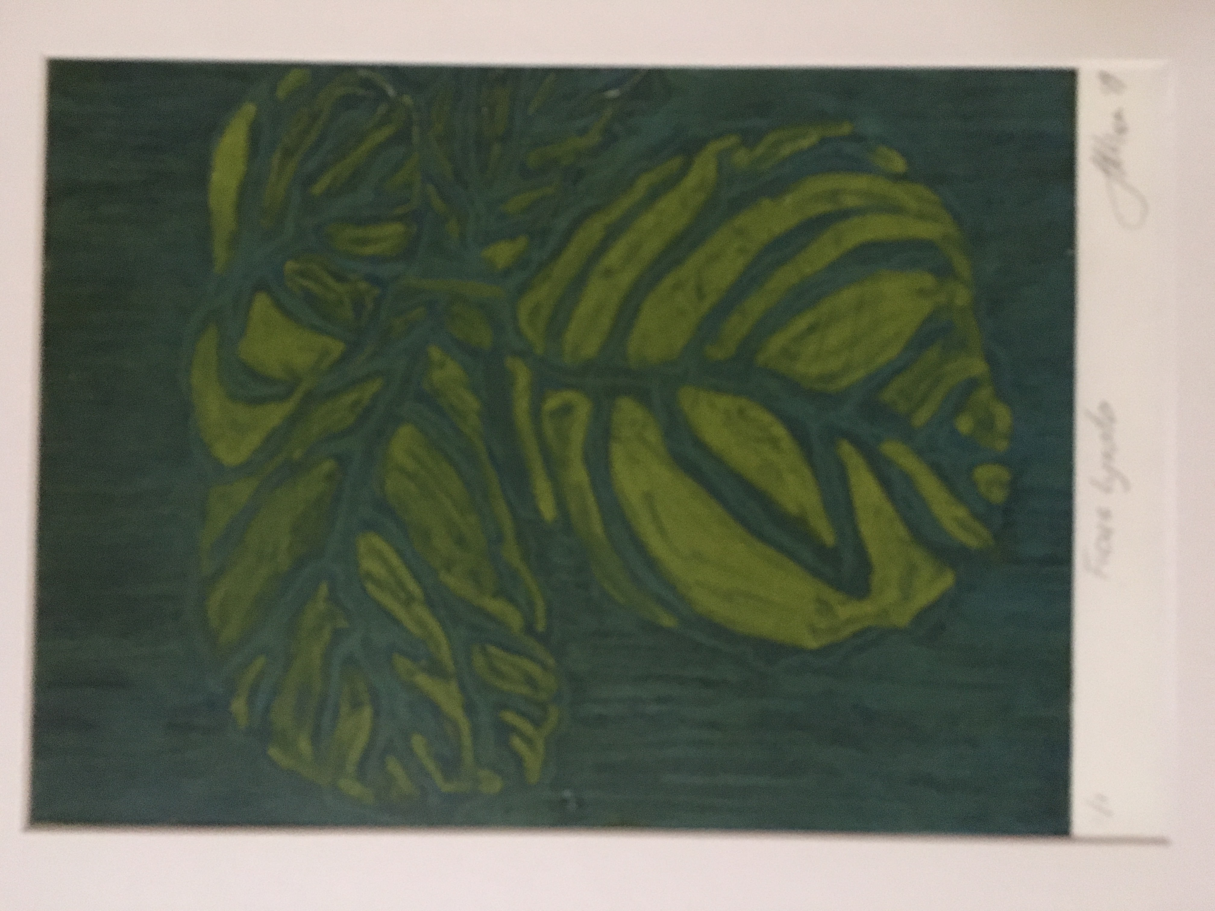 Print of plant leaves, in dark green ink.