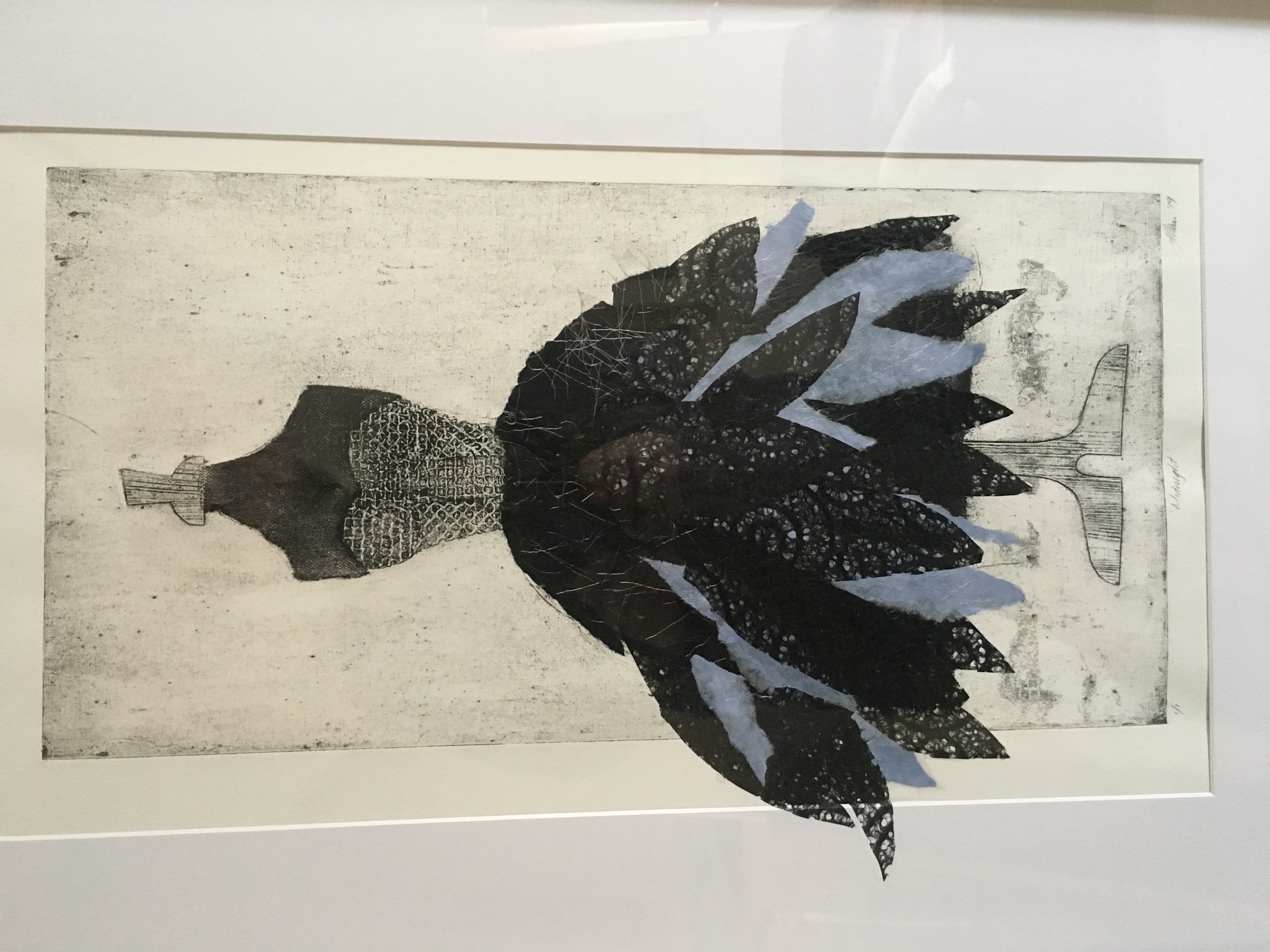 Detail of a print, showing a dress with close bodice above a gored skirt of feathers held out with many petticoats.