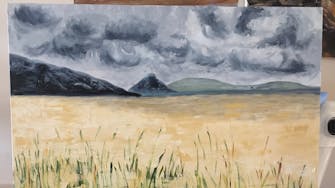 Detail of a painting of storm clouds above a wheatfield, with hills in the background.