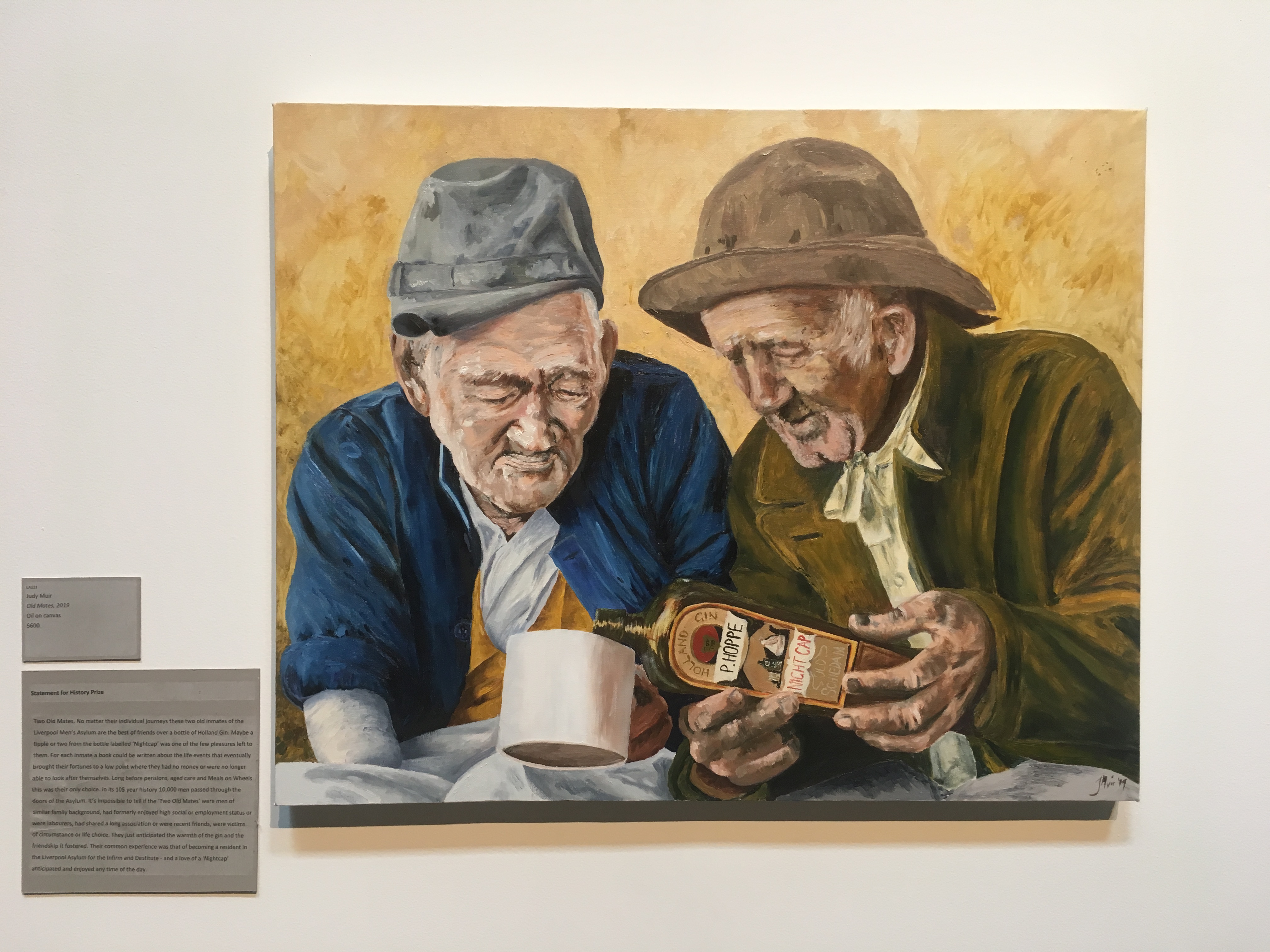 Detail of a painting of two early settlers sharing a drink.