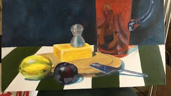 Detail of a painted still life, with cheese, fruits and a jug on a green and white striped tablecloth.