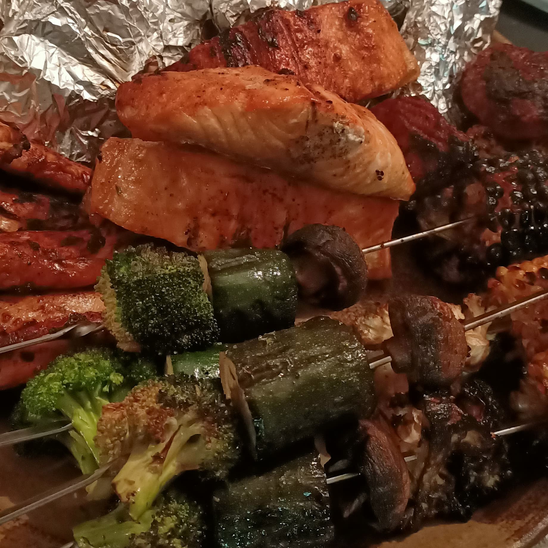 Serve of roast vegetables on three kebab skewers.