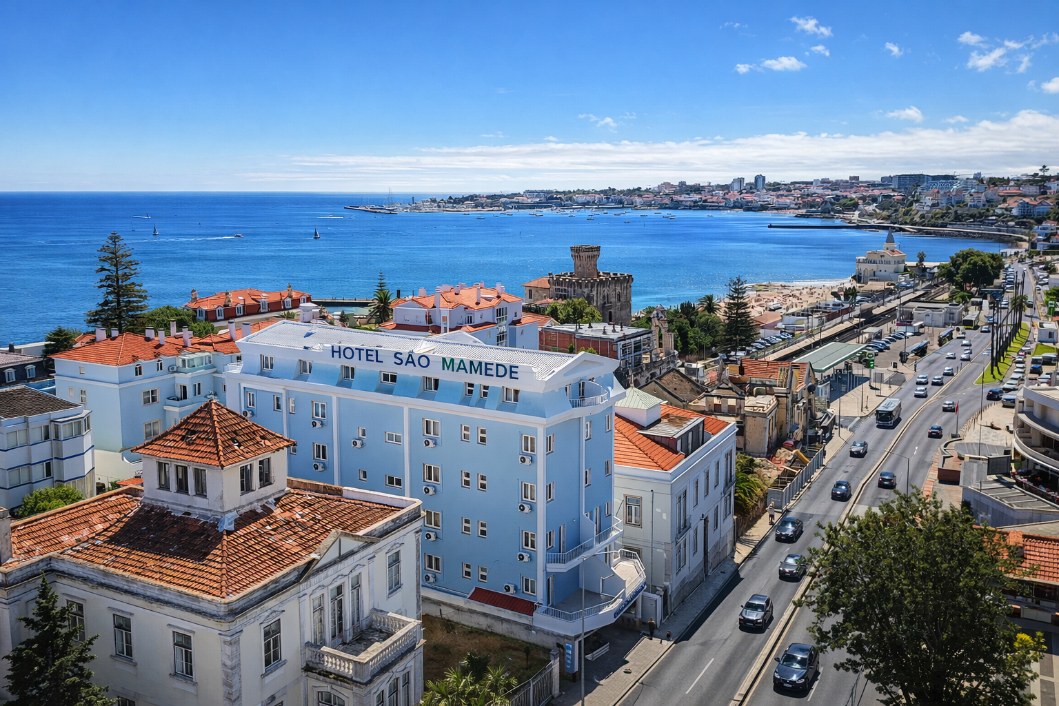 Facade of Hotel São Mamede Estoril with a panoramic view of the sea and Tamariz Beach in Cascais.
