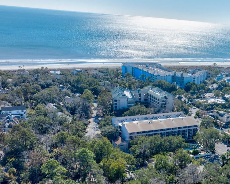 Aerial view of Hilton Head Island coastline featuring Sea Crest Surf & Racquet Club and surrounding resorts, located just ste