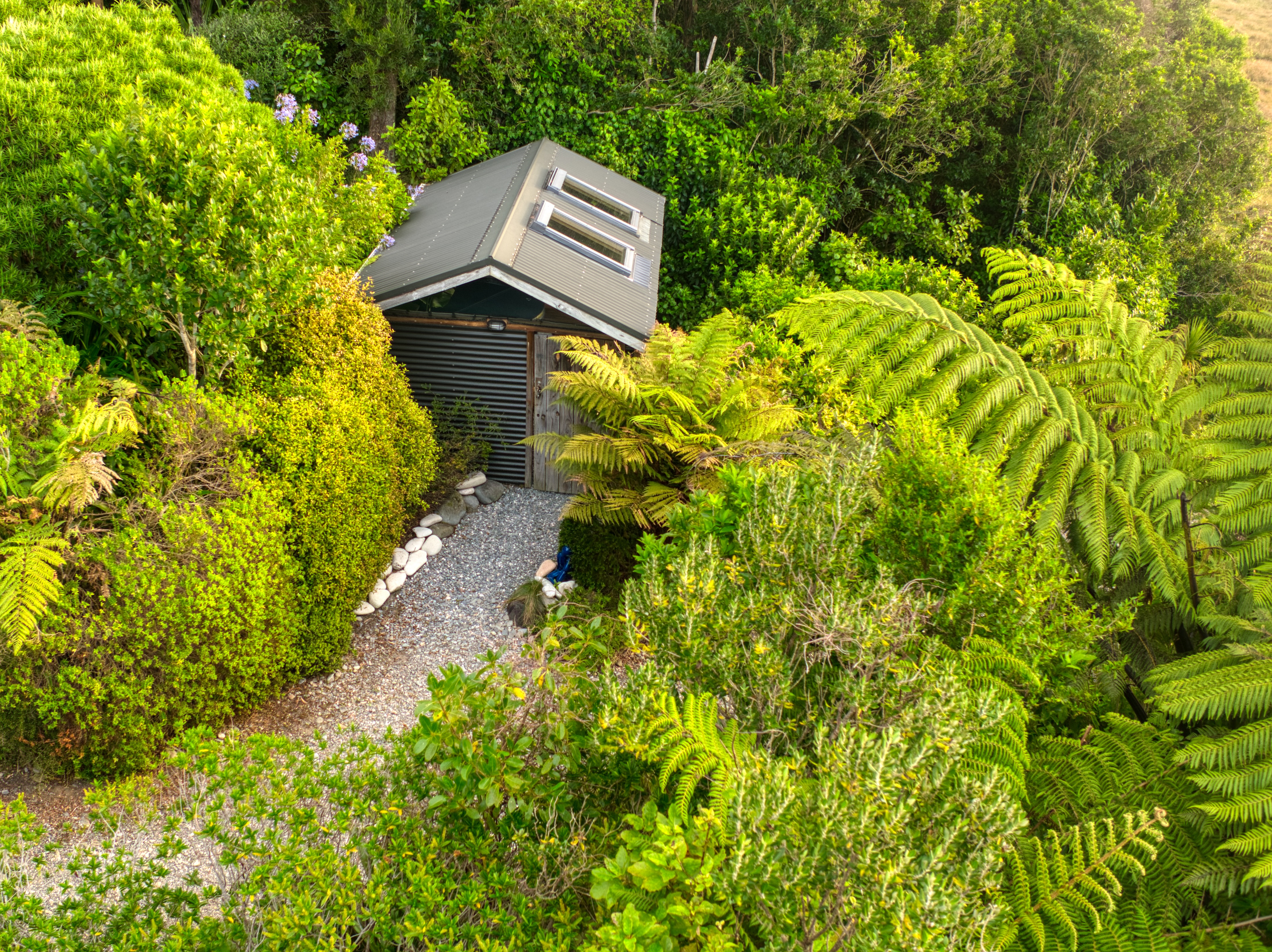Soak in our huge hot tub after exploring the west coast and the paparoa track