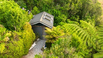 Soak in our huge hot tub after exploring the west coast and the paparoa track