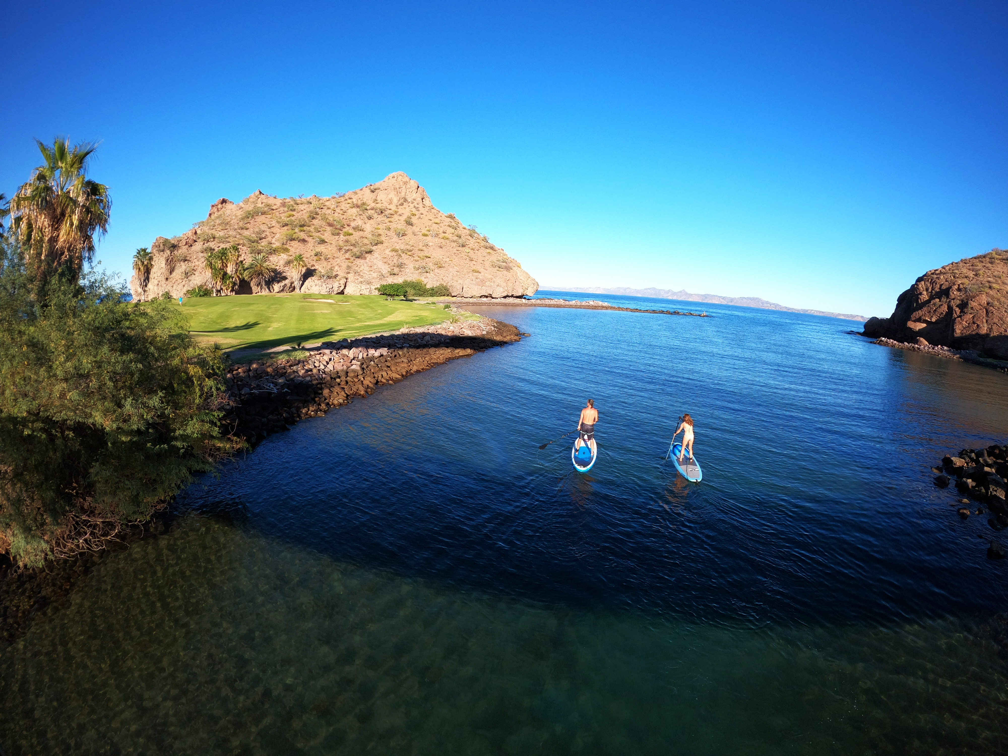 paddle boarders in Loreto Bay with Aventuras Hotel