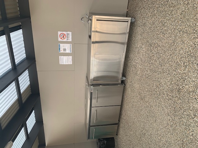 Communal barbeque area with wash area.