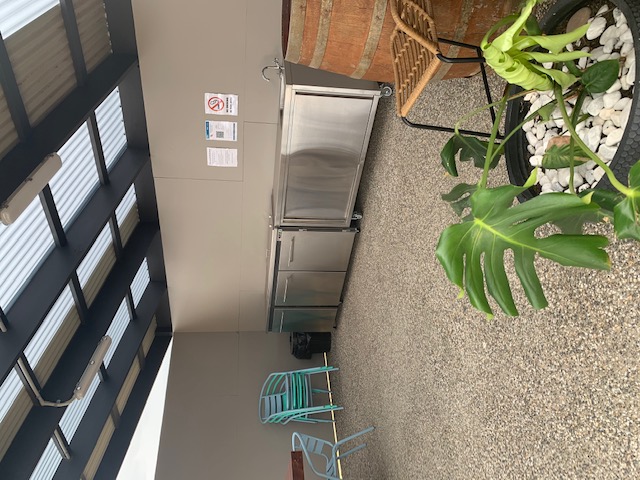 Communal barbeque area with wash area.