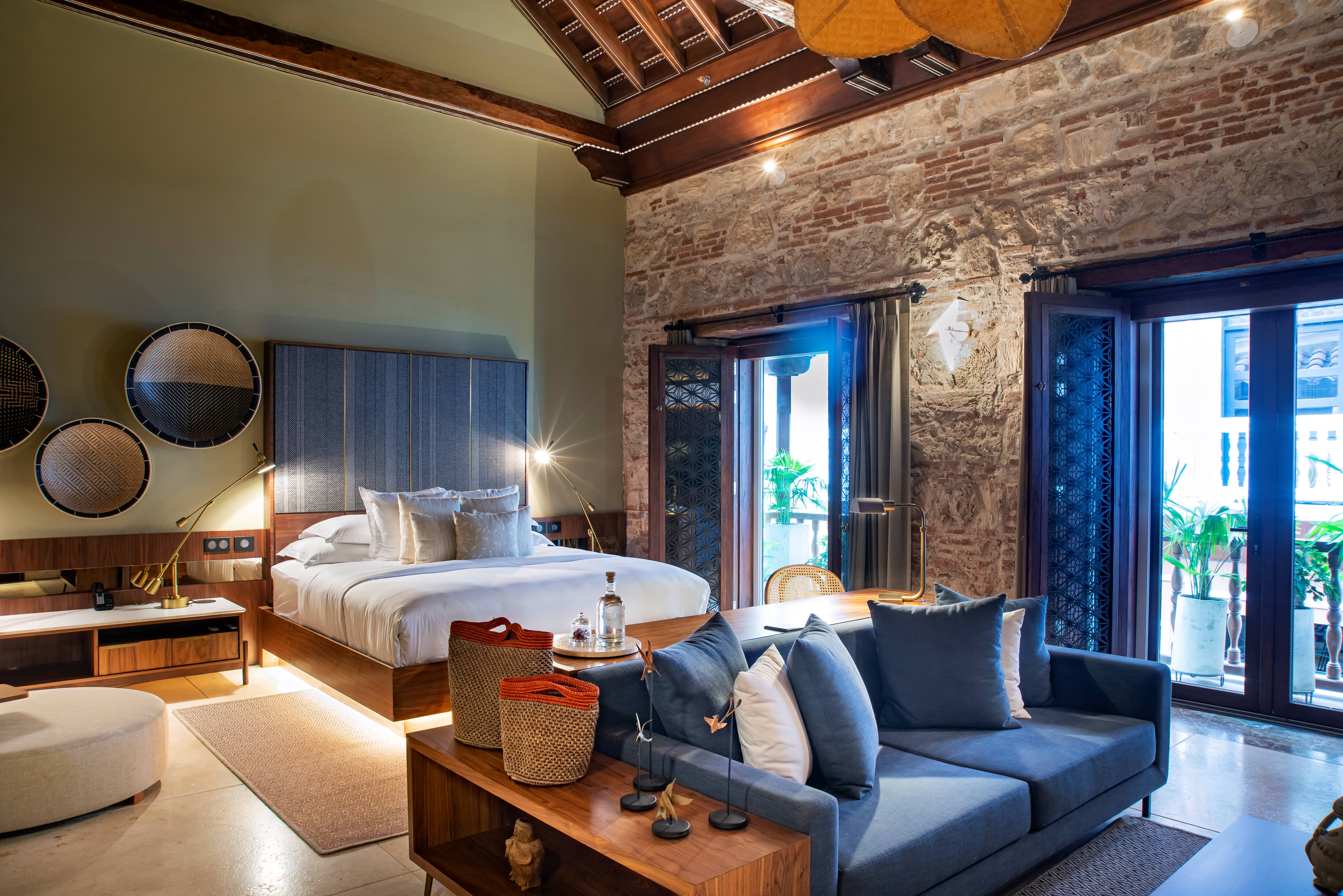 Casona del Porvenir suite with wooden beams, king bed and balcony