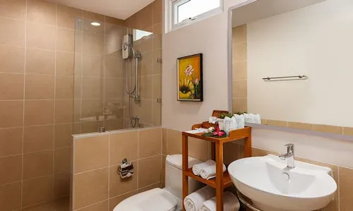 Modern bathroom with bathtub, shower and essential amenities