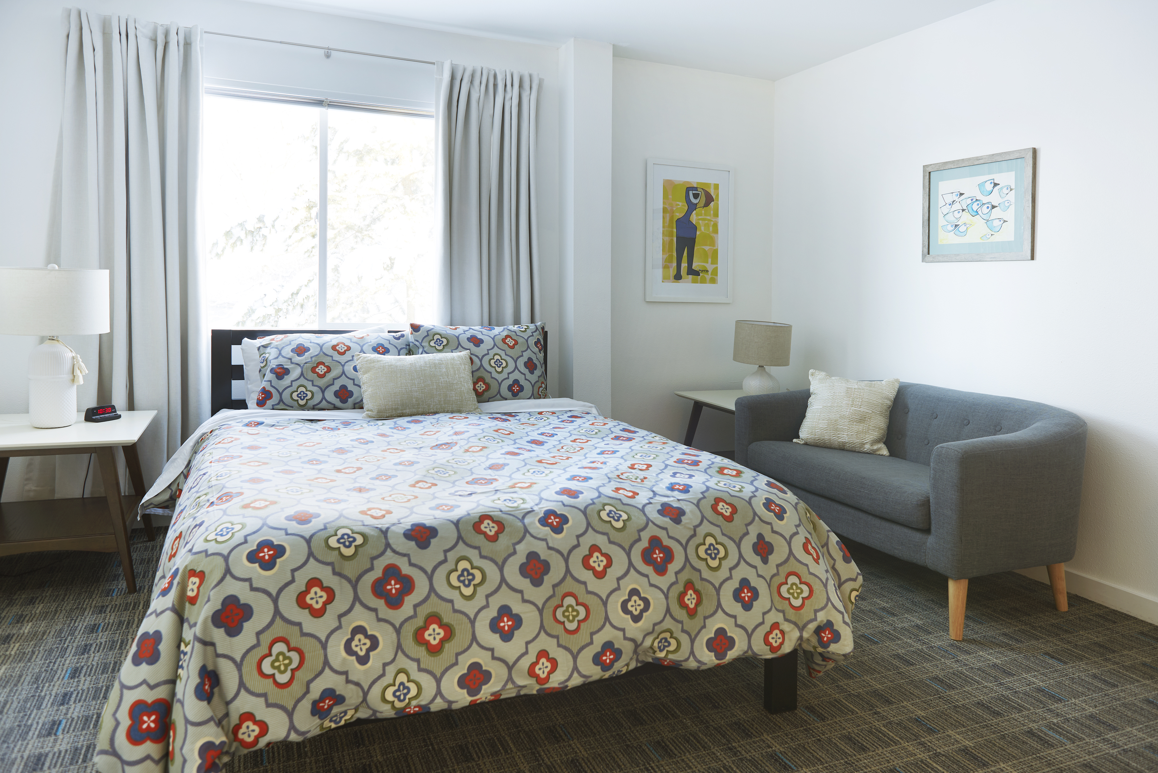 One queen bed and private bathroom in the Magpie Room at Snob Hollow Inn.