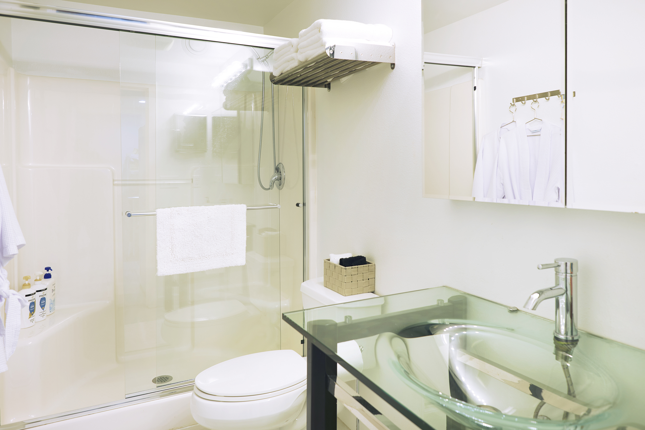 Queen bed with shared bathroom