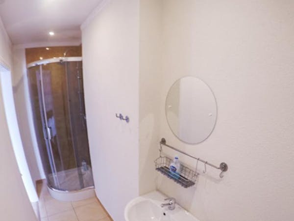 Ensuite bathroom with shower, sink and toilet. Towels and toiletries provided
