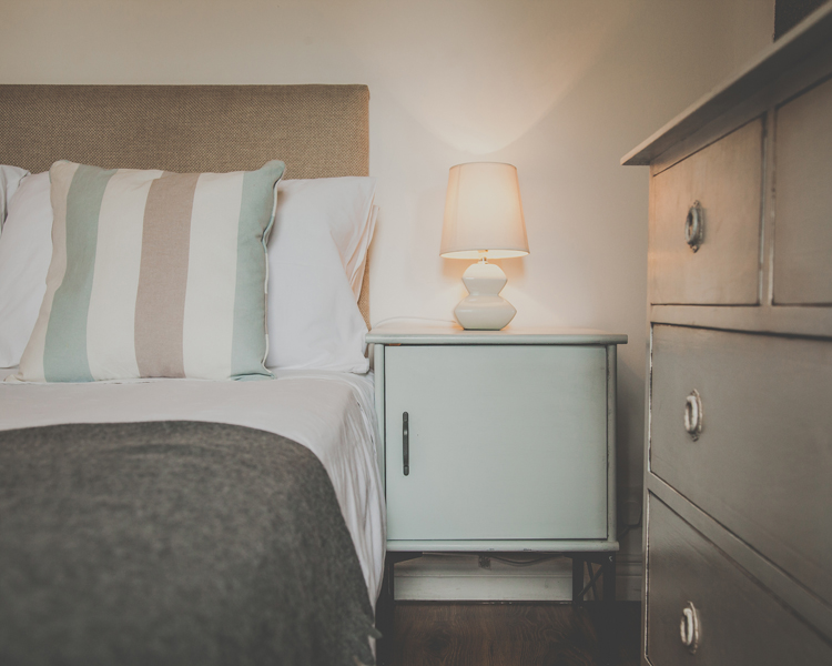 Homemade Shabby chic furniture in a double room with atmospheric lightning