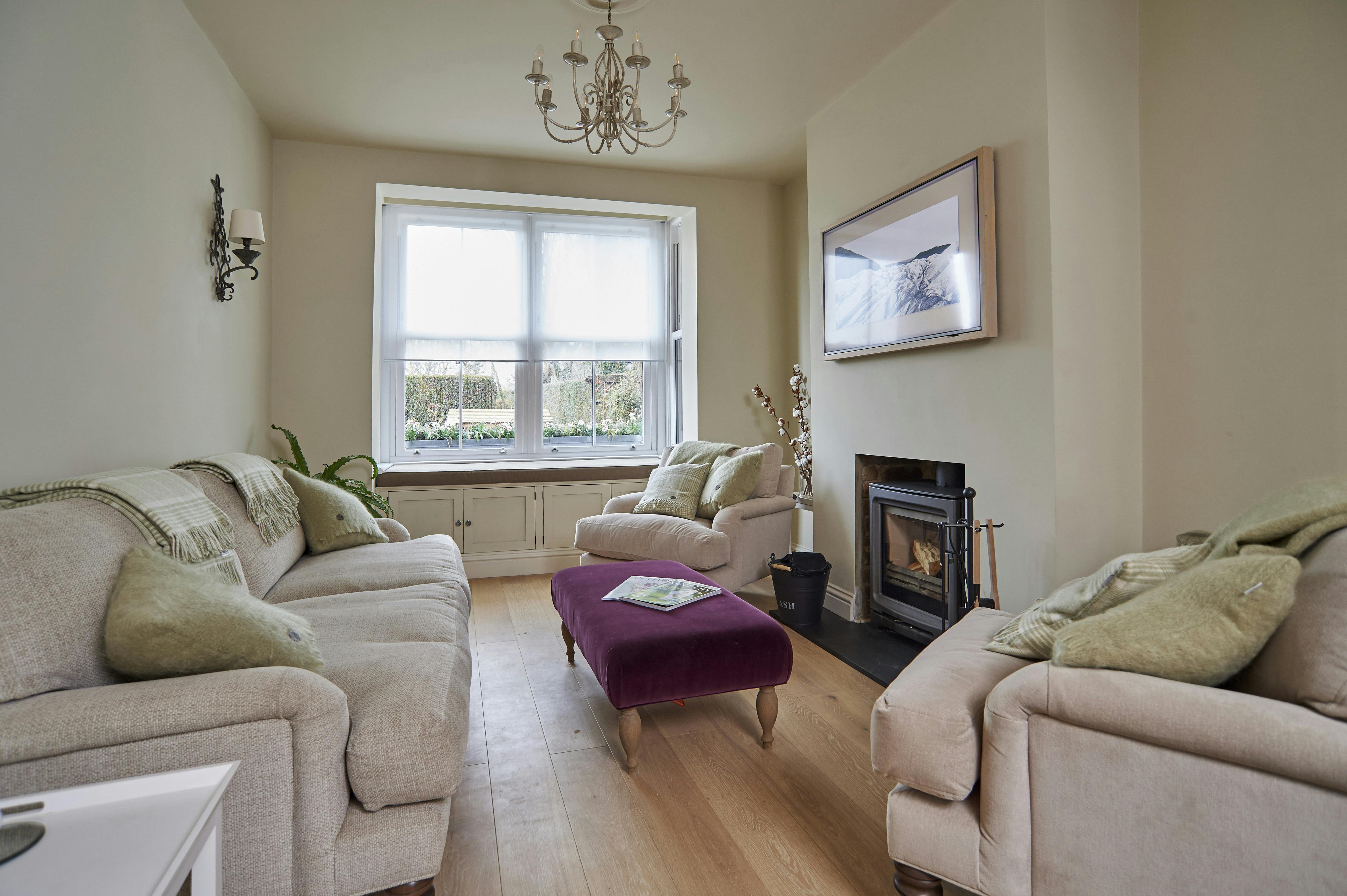 The Living Area. Aquaclean Sofas & Armchairs, cushions and blankets, velvet foot stall, bay window seat, log burner & TV