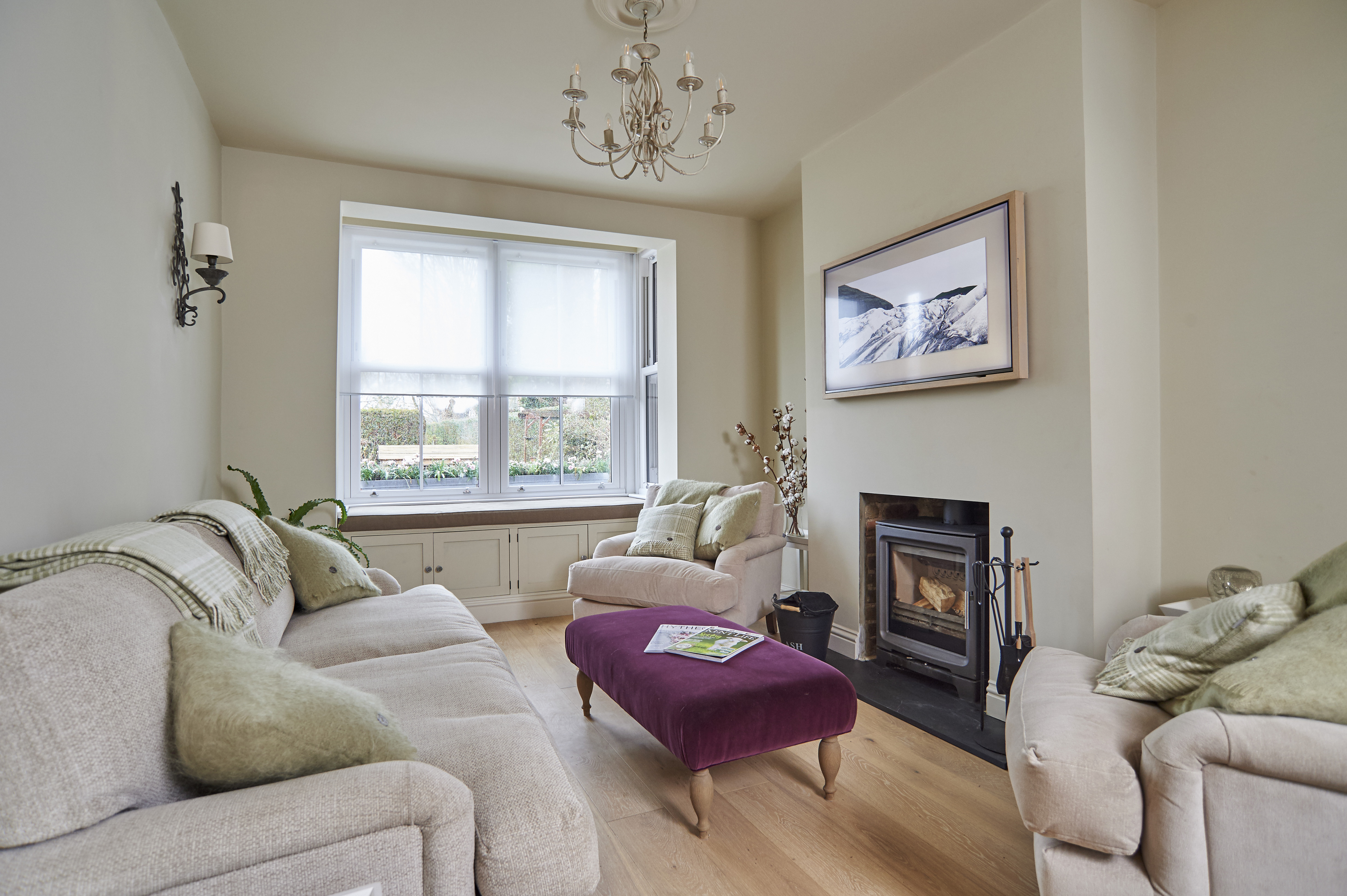 The Living Area. Aquaclean Sofas & Armchairs, cushions and blankets, velvet foot stall, bay window seat, log burner & TV