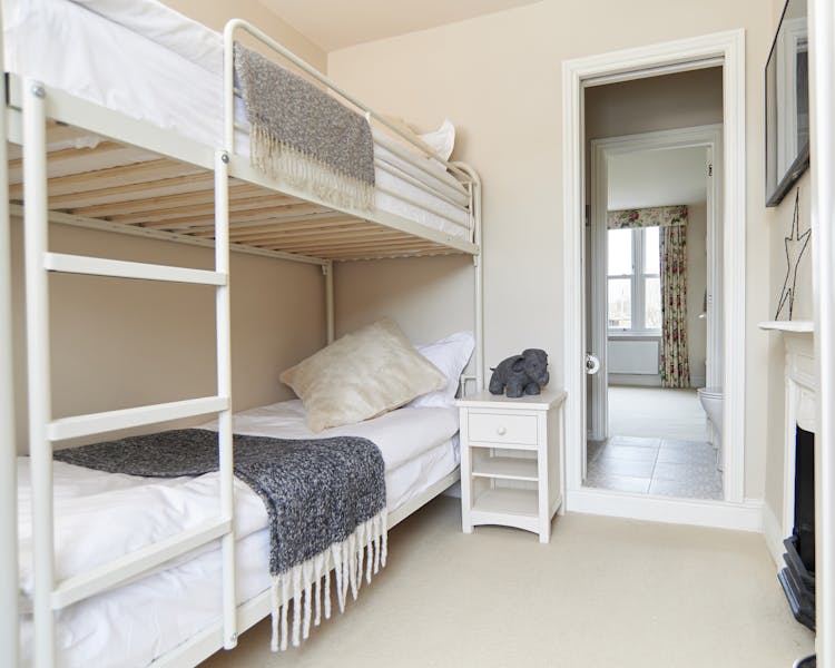 Bunk Room Beds and sidetable through to Jack and Jill ensuite linking to Master Bedroom