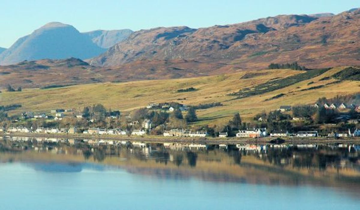 Main street in Lochcarron across the loch. Visit or stay at the Lochcarron Hotel.