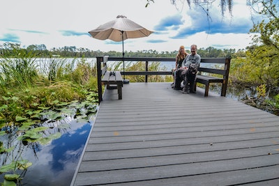 Mike, Judy & Bates on the dock at Lake Lagonda