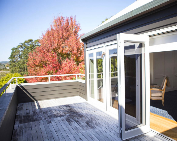 Sunny outdoor deck - Purangi Suite, 970 Lonely Bay Lodge