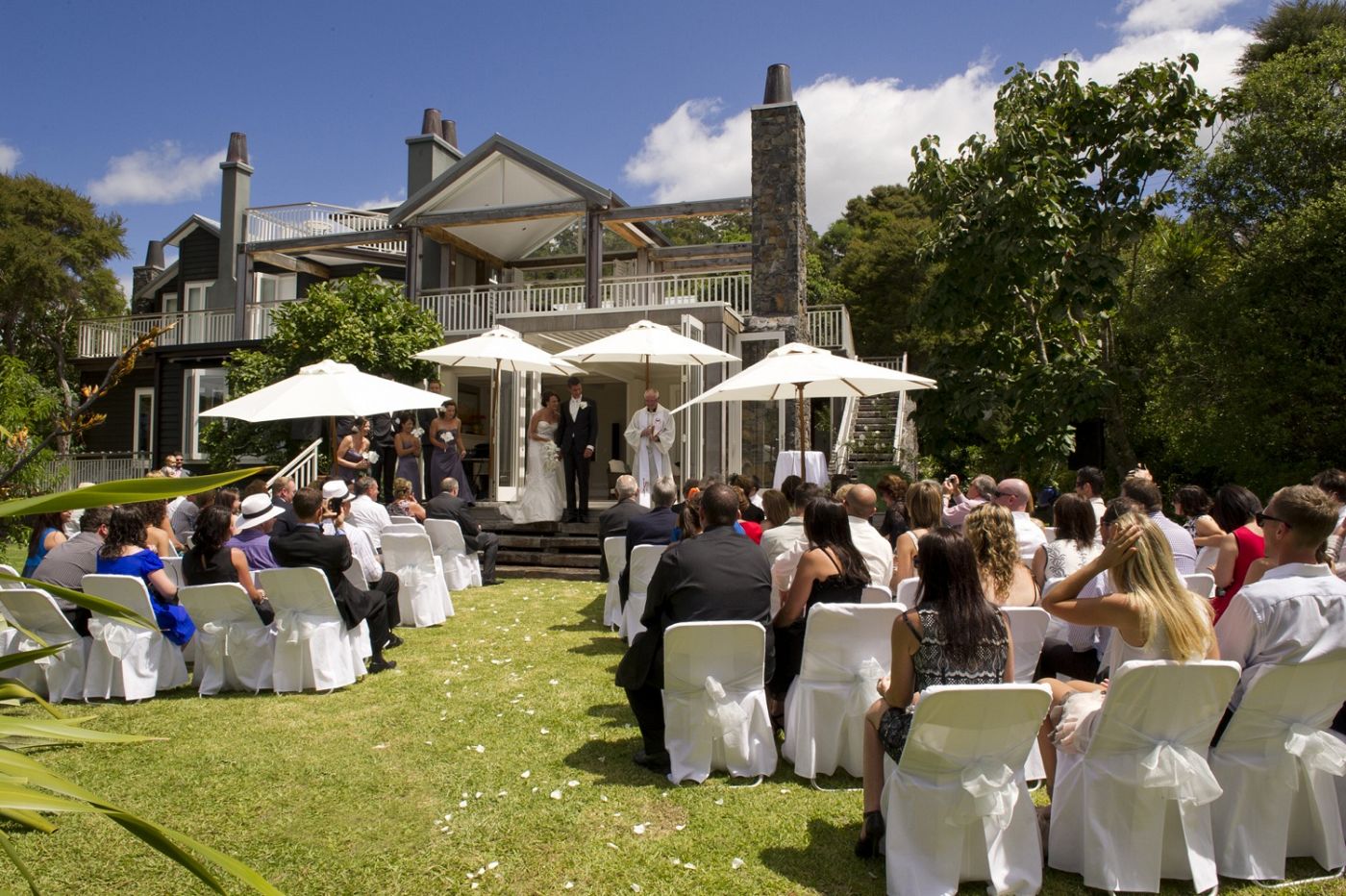Outdoor wedding ceremony on front lawn - 970 Lonely Bay Lodge