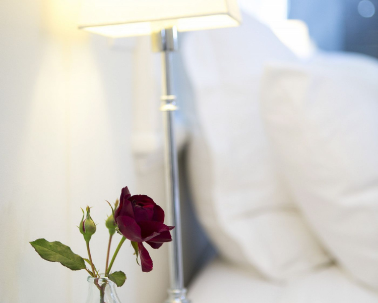 Side table with bedside light - Atrium Suite, 970 Lonely Bay Lodge